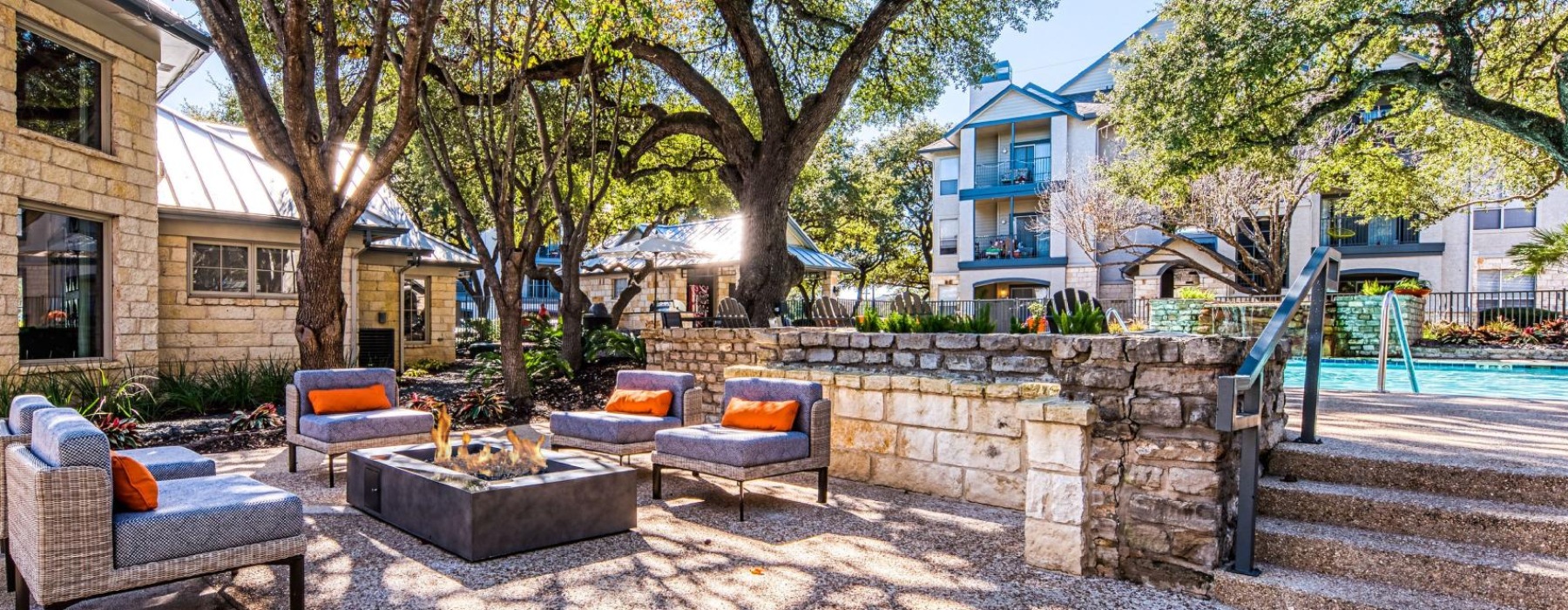 a patio with chairs and tables