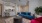 a living room with a blue couch and a table